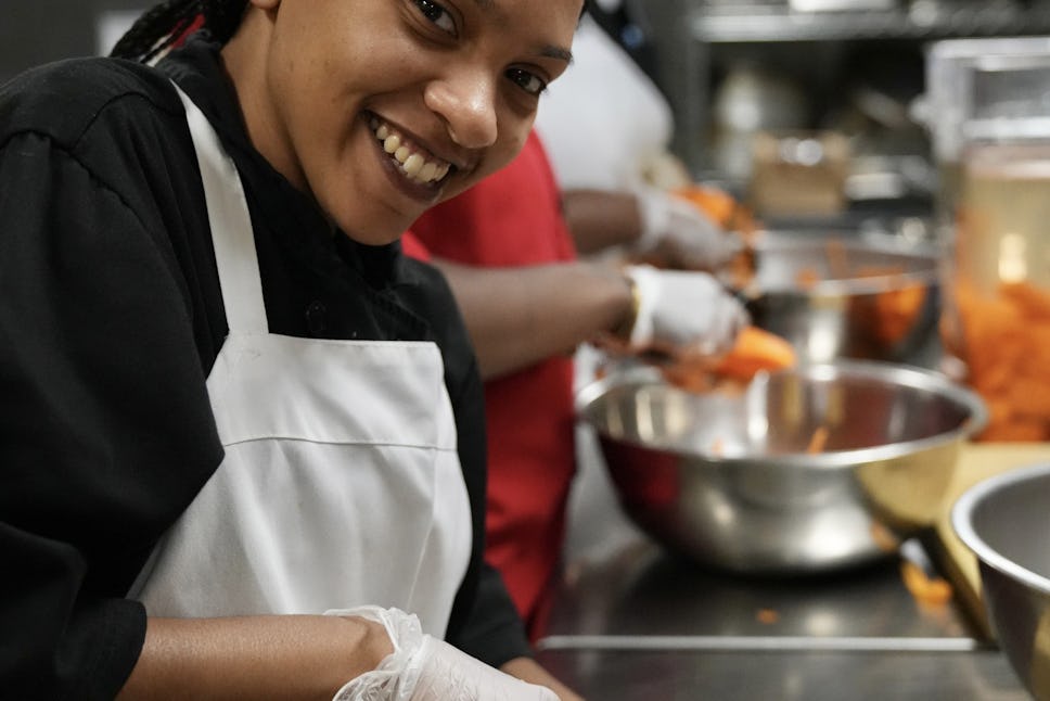 A Cut crew member at work in The Door's onsite kitchen.